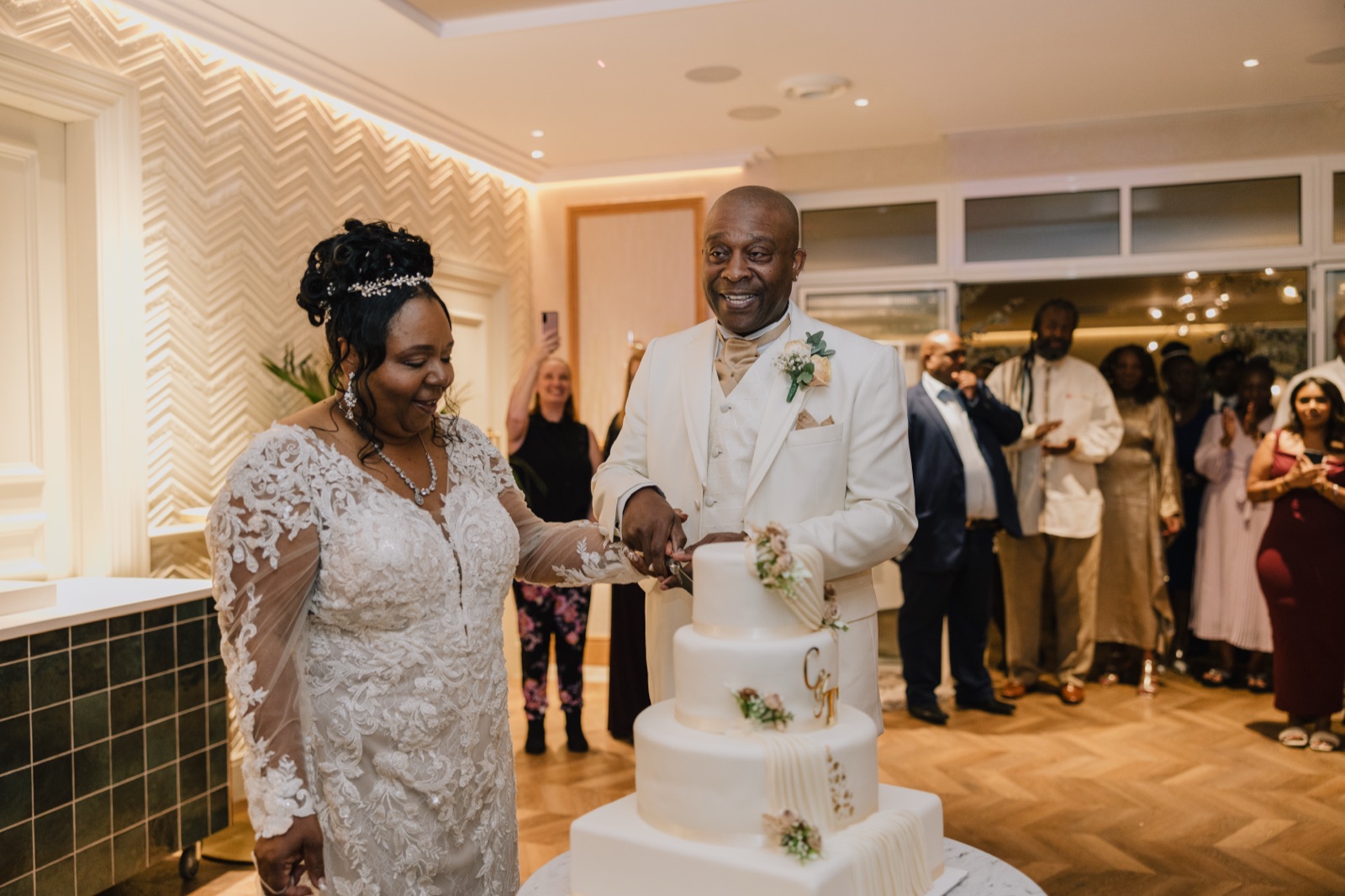Carl and Tracey cutting their wedding cake at Fairlawns Hotel evening reception