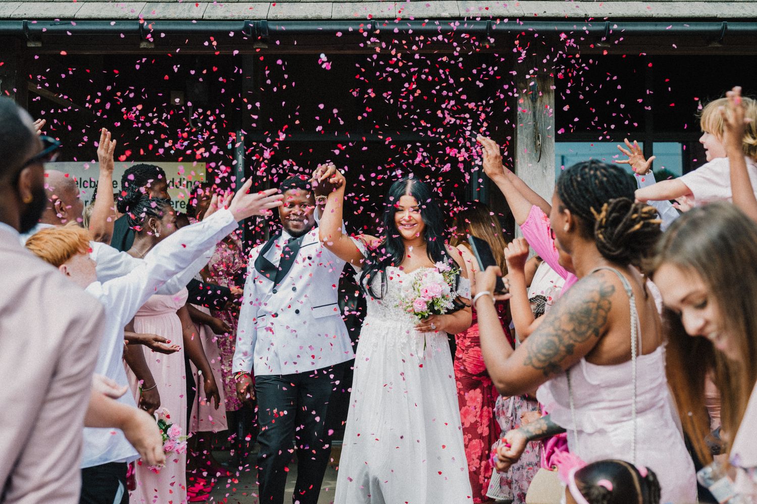 Melanie and Cornelius wedding at Westbury Village Hall, Shropshire, confetti outside the entrance
