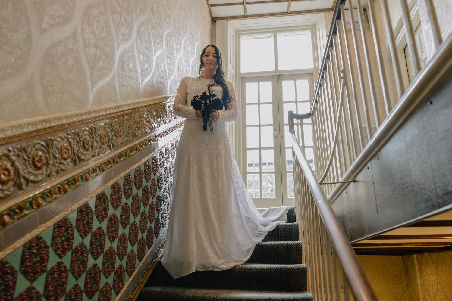 Bride on the grand staircase inside the Valley Hotel, Ironbridge