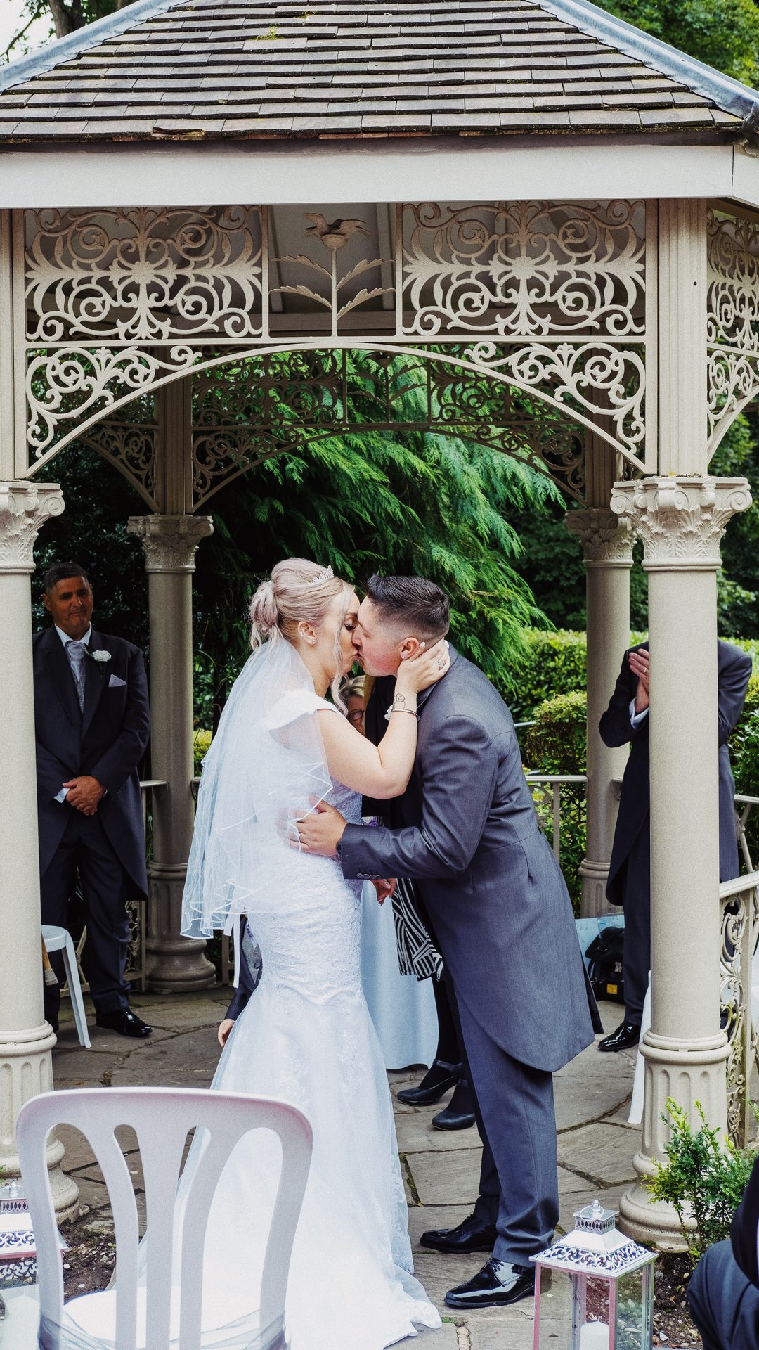 First kiss under the terrace gazebo at a Valley Hotel wedding, Ironbridge, Shropshire